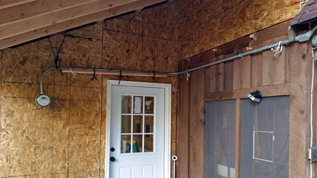 The deck looking toward the kitchen.  The roofing in this small area will enable a location protected from rain/snow.   Jon said that a very short wire between the meter and the panel box should be replaced by a master electrician working with the electrical company.